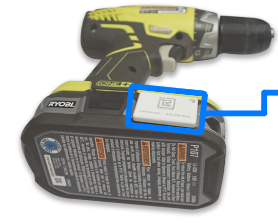 RoviTracker Bluetooth tracking tag mounted on a cordless drill battery